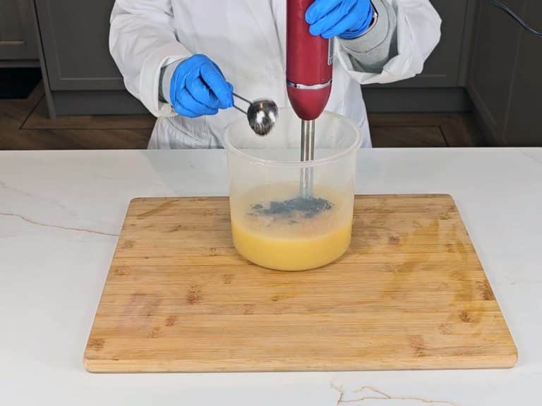 Used coffee grounds are added to the soap batter at trace