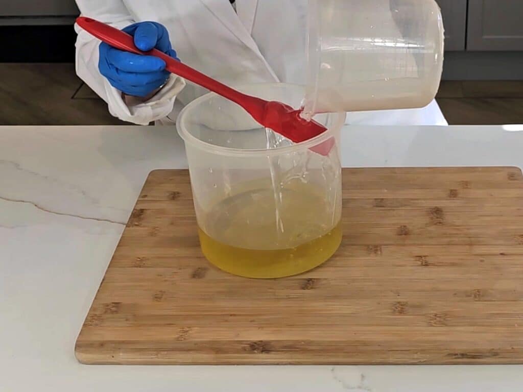 The lye solution is poured into our oils