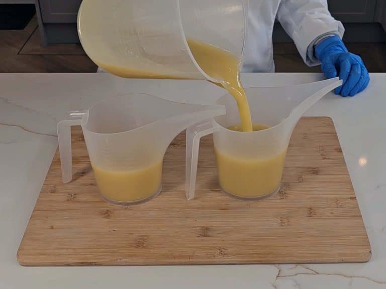 The soap batter is split between two soap pouring jugs