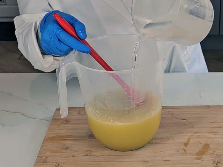 The lye solution is mixed with our warmed oils and powdered goats milk