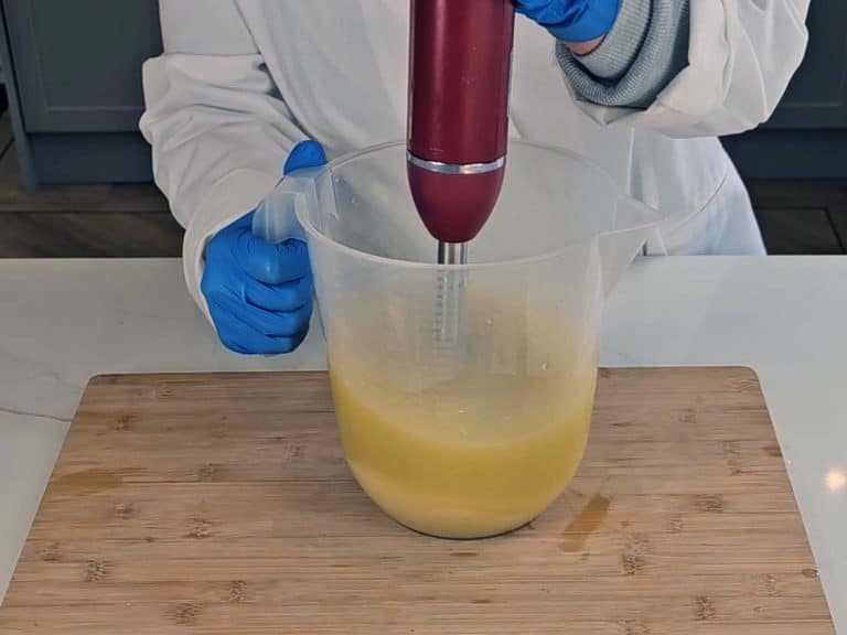 The soap batter is blended with a stick blender