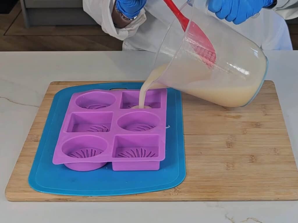 The batter, which is a consistency that matches trace, is poured into individual soap molds, made of stretchy silicon.