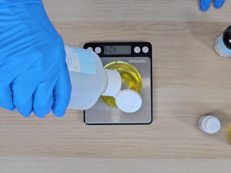 Oil is poured into the beaker