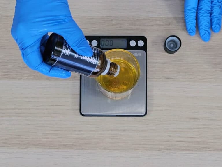 Next, add the Vitamin E and the essential oils