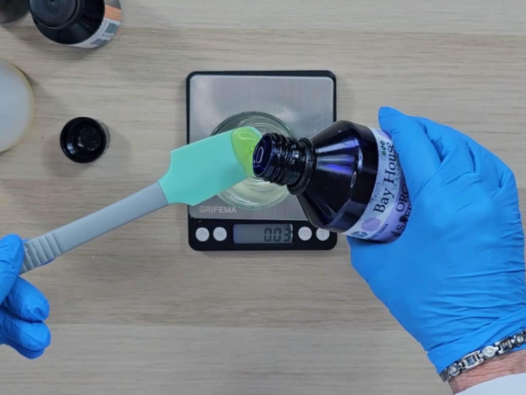 Sunflower oil is measured into the beaker
