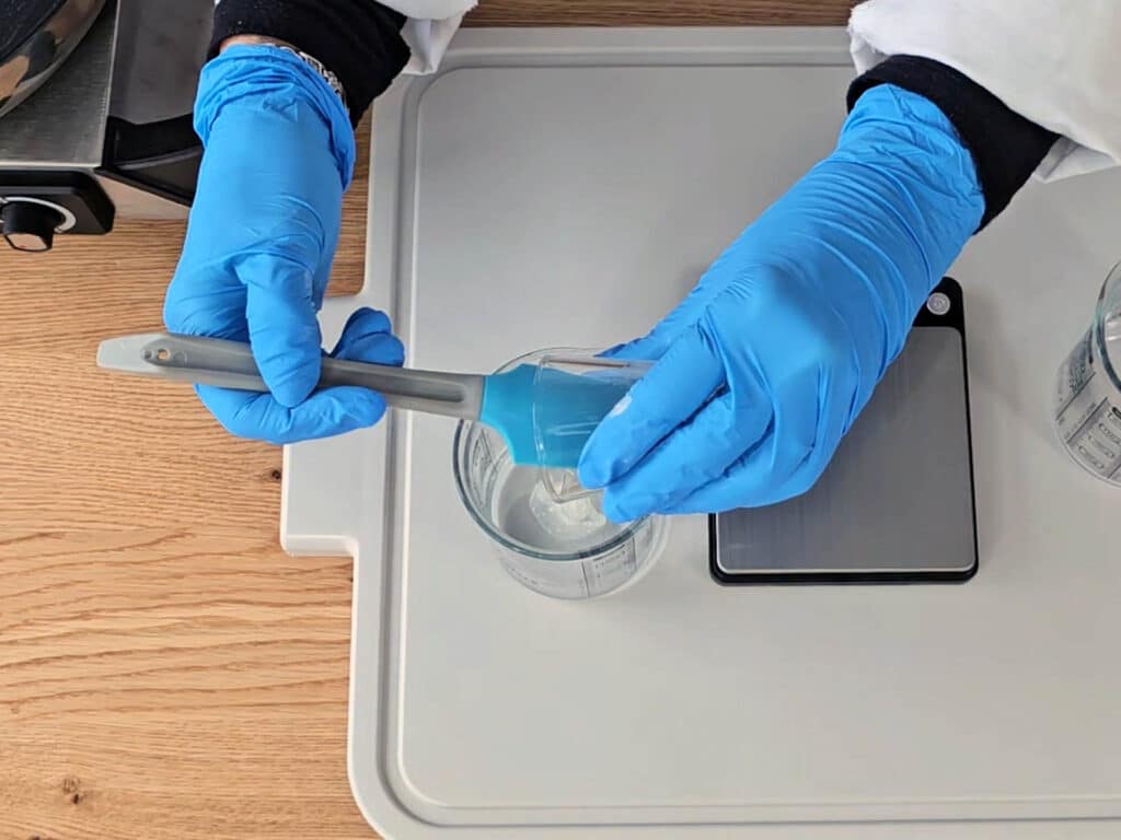 Weigh the glycerin into a separate beaker, and add the xanthan gum. Stir to create a slurry before adding to the distilled water.