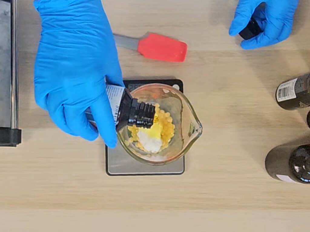 Liquid oil is measured for a cuticle balm recipe Liquid oil is measured for a cuticle balm recipe