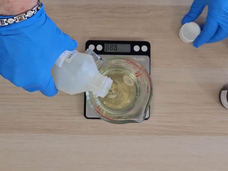 Liquid oil is added to the beaker