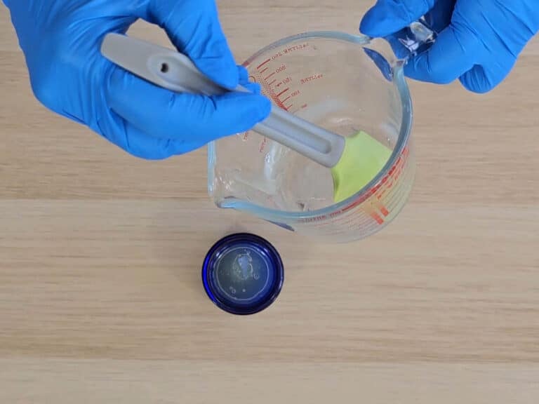 The finished butter balm is poured into a pot