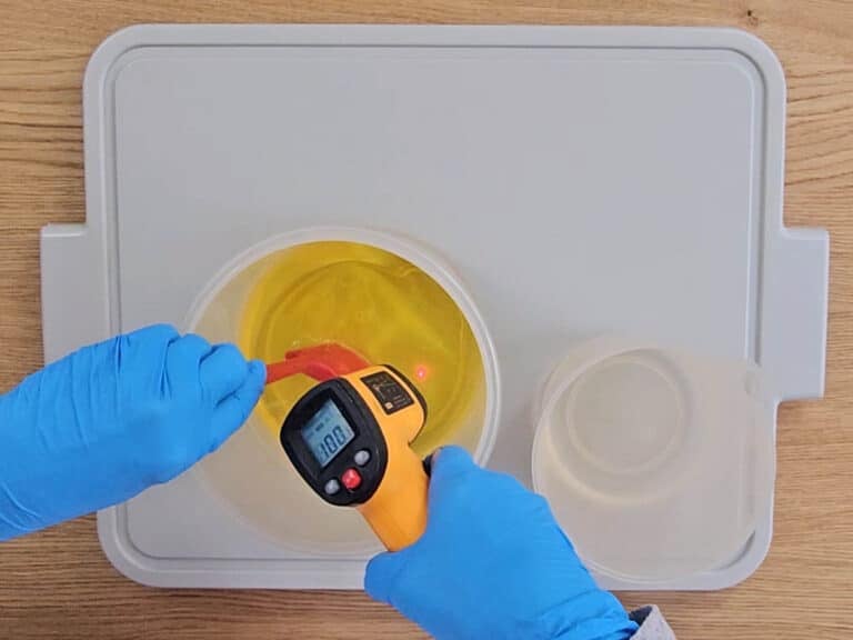 The melted oils and lye are balanced and tested with a lazer temperature gun The melted oils and lye are balanced and tested with a lazer temperature gun