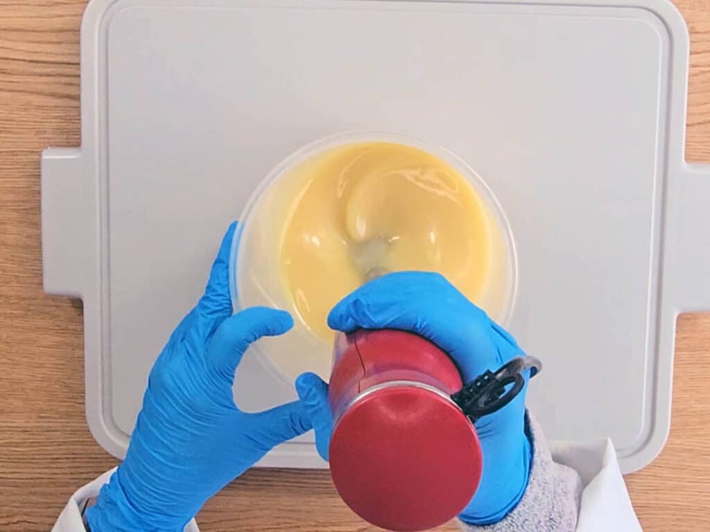 The mixture is blended with a stick blender