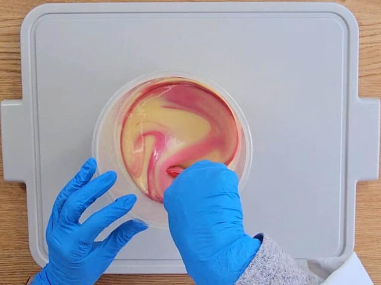 The pink mica is stirred into the soap batter The pink mica is stirred into the soap batter