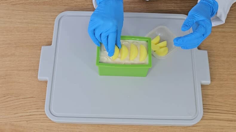 gently place the embedded toppers onto the soap.