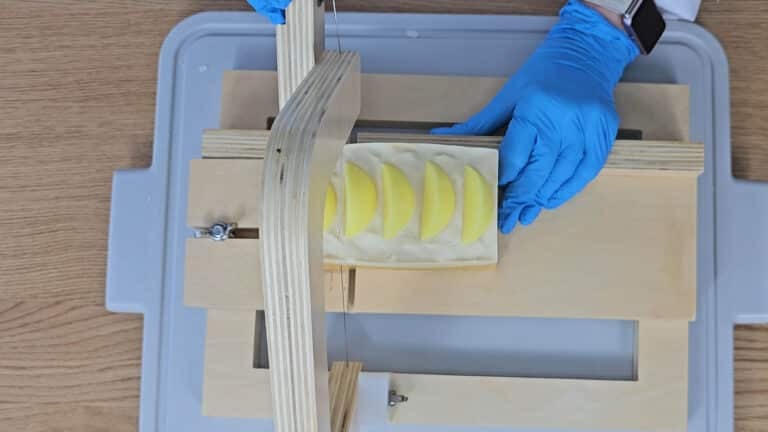 Carefully cut it into slices. Carefully cut it into slices.