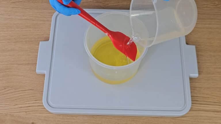 pour your lye solution into your oils. pour your lye solution into your oils.