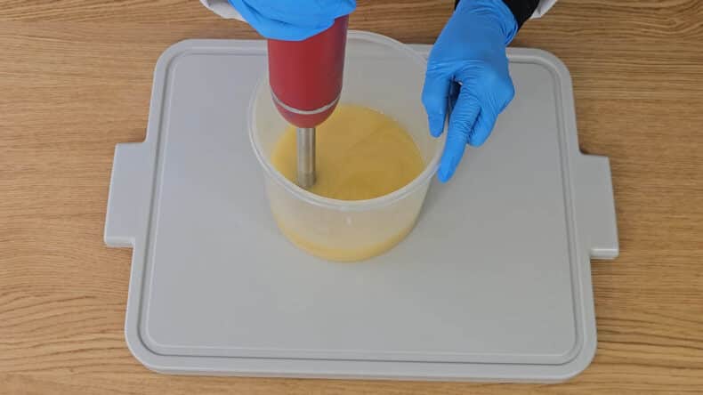 Turn the stick blender on and blend until all the oils have been fully emulsified into the lye solution