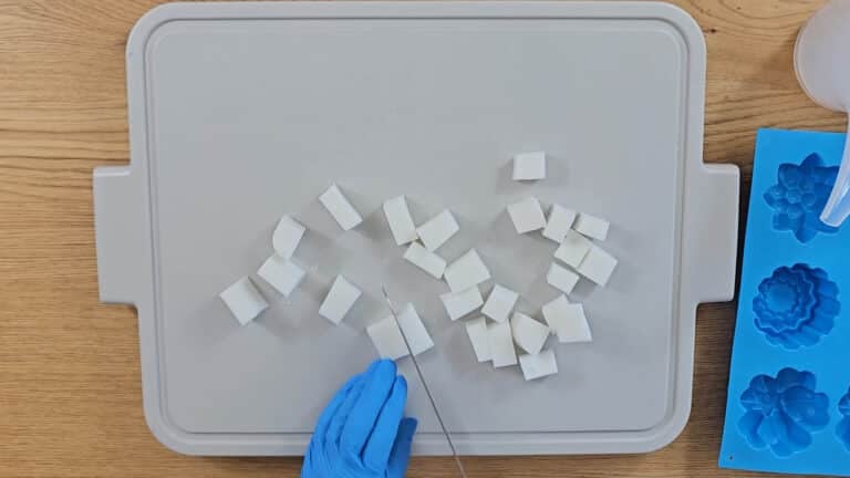 Weigh and cut the soap into small cubes. Weigh and cut the soap into small cubes.