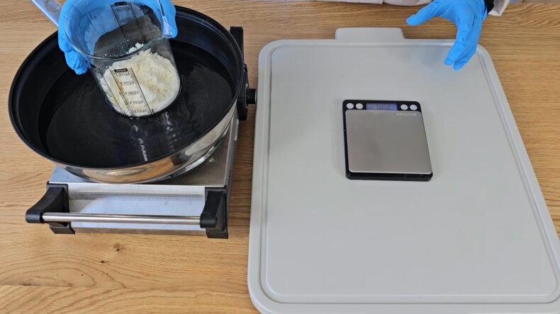 To melt the oils, place the beaker into a water bath