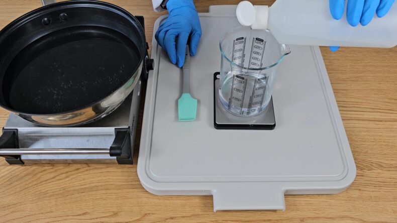 Place the water ingredients into one of the heatproof beakers