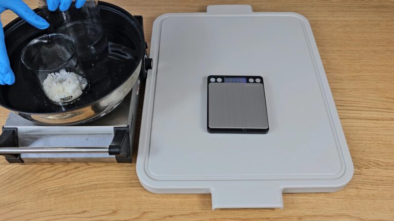 Place both beakers into the water bath. Place both beakers into the water bath.