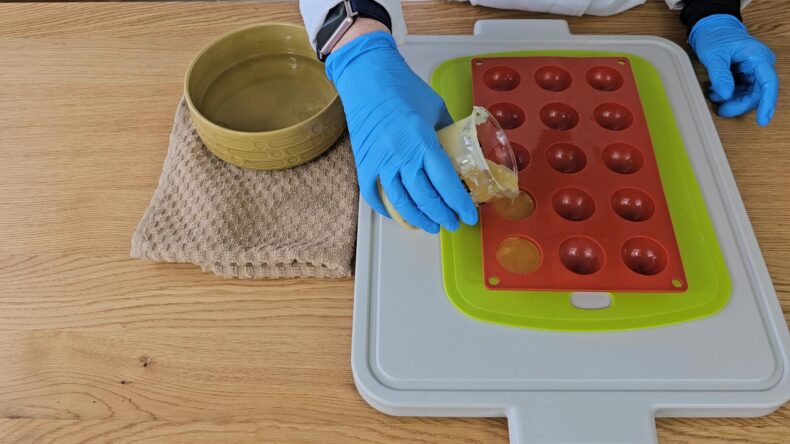 Pour the oils into the mold.