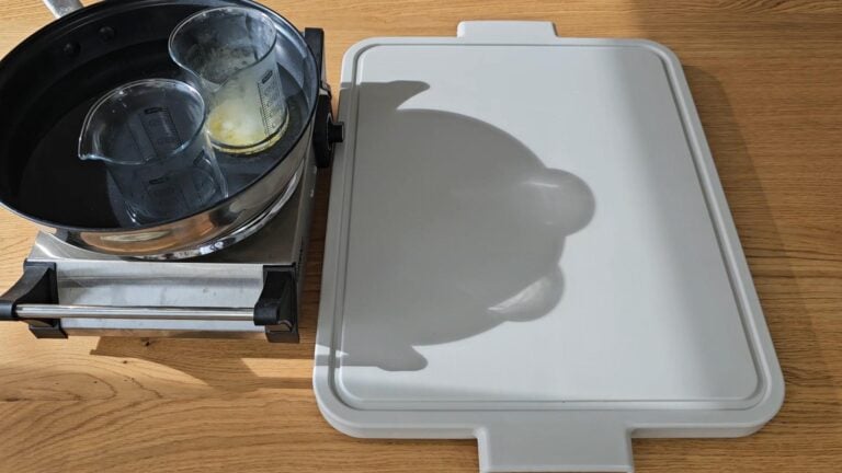 Place both beakers into the water bath. Place both beakers into the water bath.