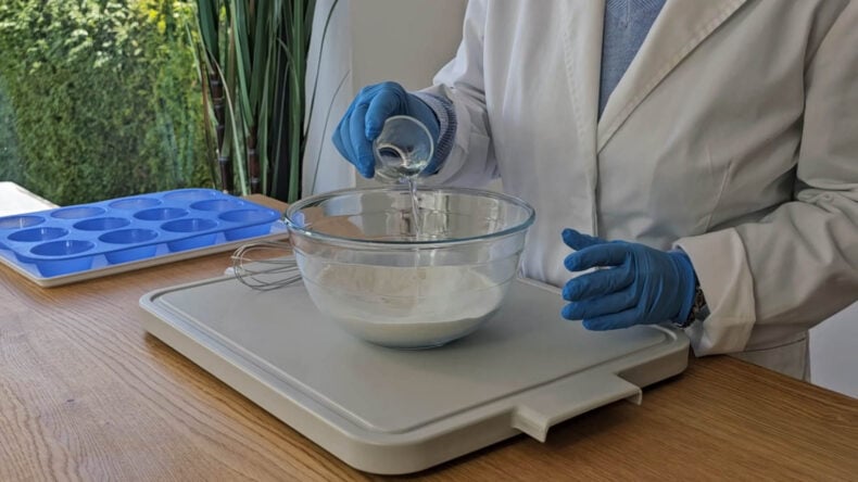 Adding lavender essential oil to the dry shower steamer ingredients Adding lavender essential oil to the dry shower steamer ingredients