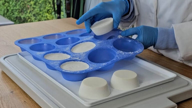 Removing a dried homemade shower steamer from the silicone mould Removing a dried homemade shower steamer from the silicone mould